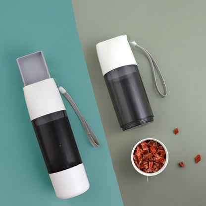 HydraPaws Travel Water Bottle with segmented design for water and food storage.