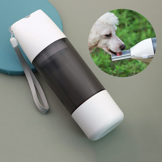 Pet drinking from the HydraPaws Travel Water Bottle during a walk